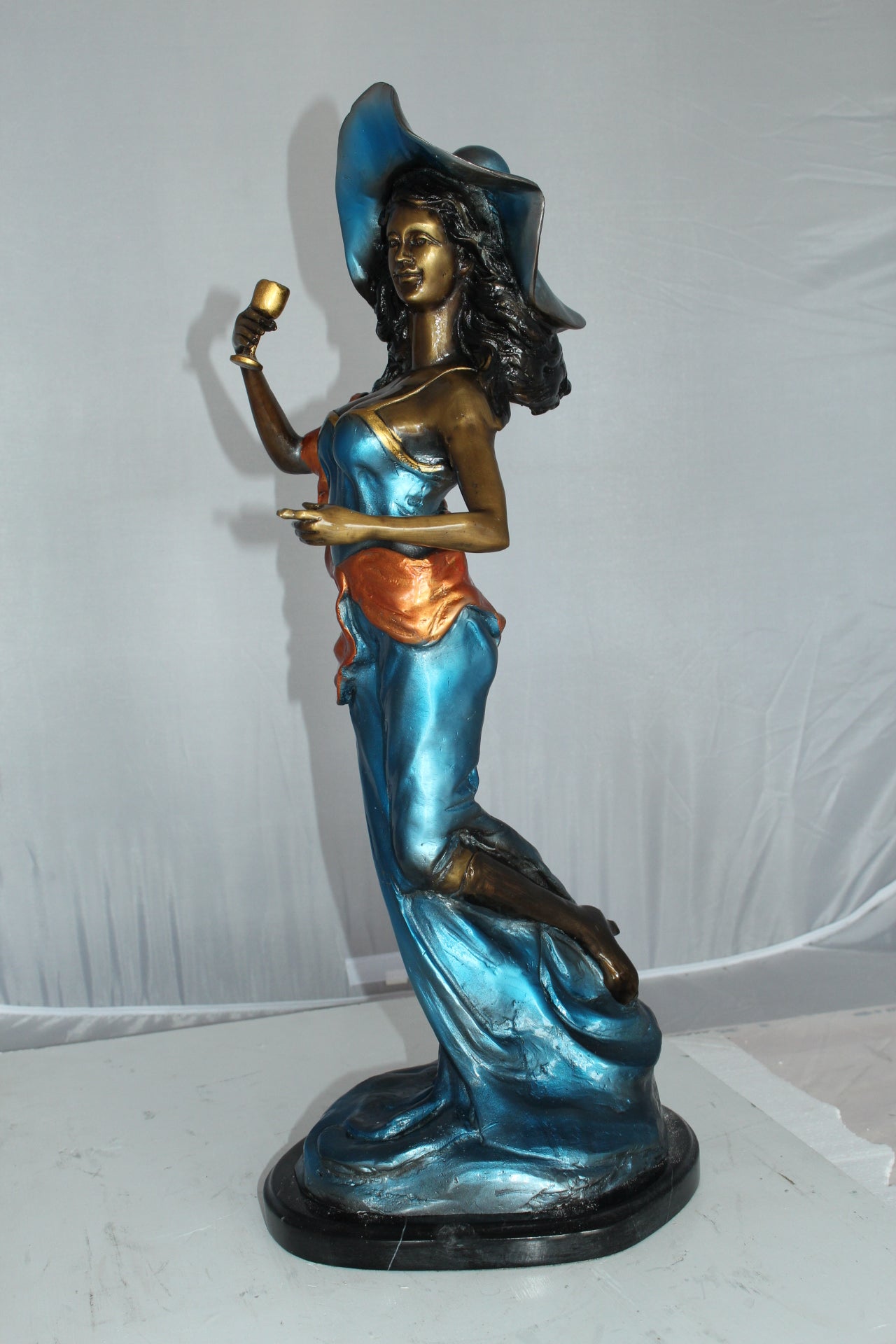 Lady Holding a Wine Glass Bronze Statue -  Size: 9"L x 11"W x 26"H. 