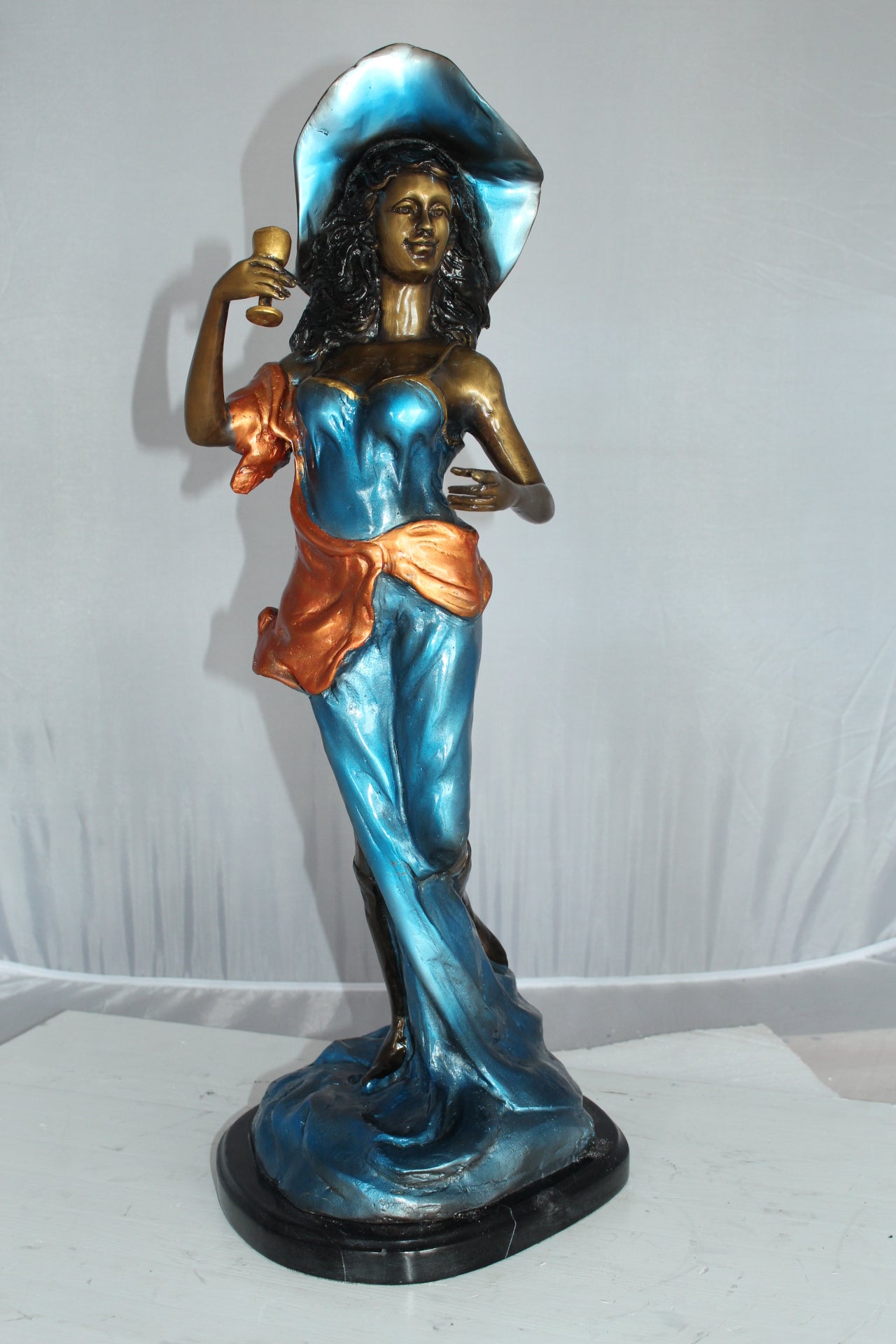 Lady Holding a Wine Glass Bronze Statue -  Size: 9"L x 11"W x 26"H. 
