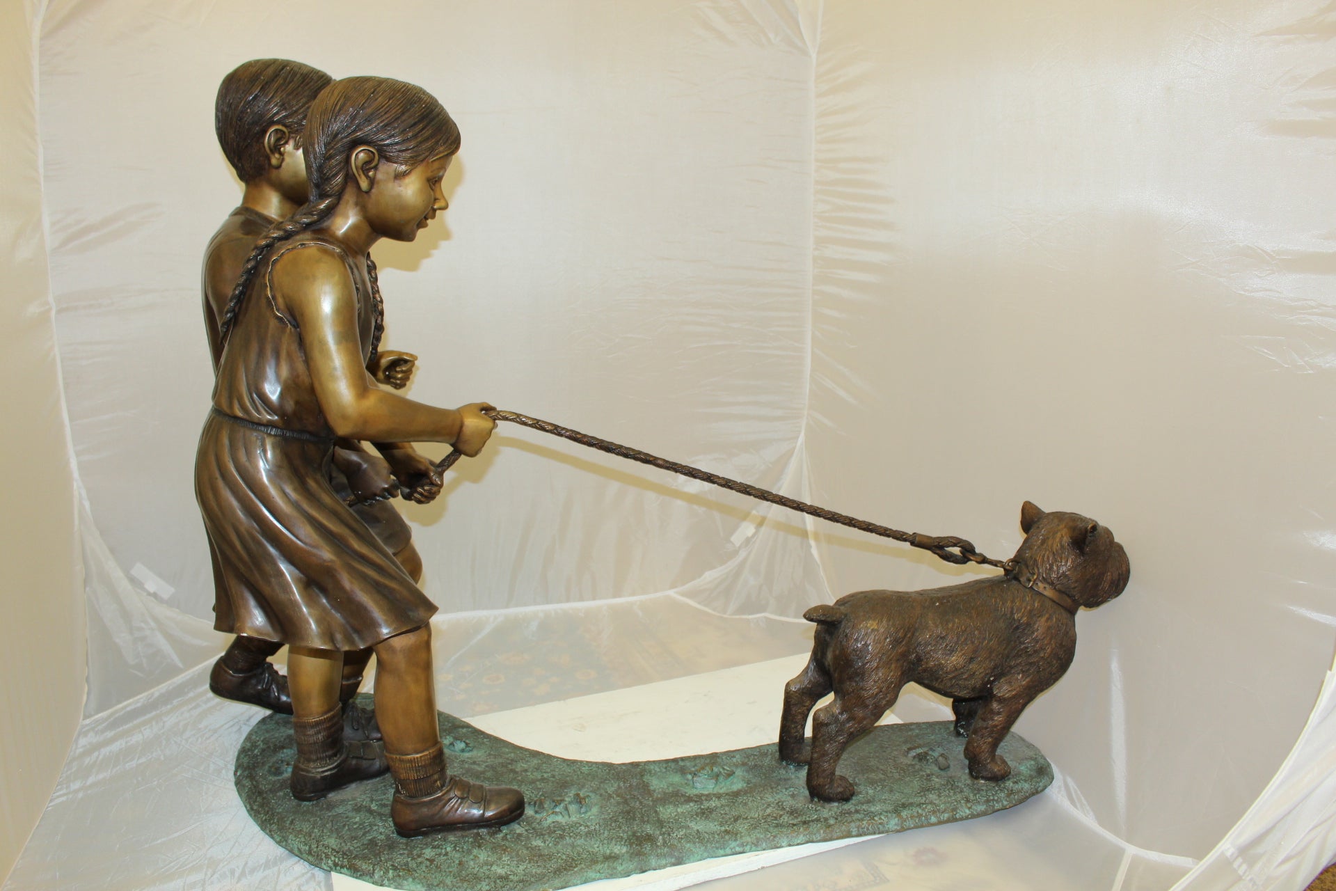 Two Kids Walking a dog Bronze Statue -  Size: 55"L x 28"W x 37"H. 