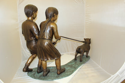 Two Kids Walking a dog Bronze Statue -  Size: 55"L x 28"W x 37"H. 