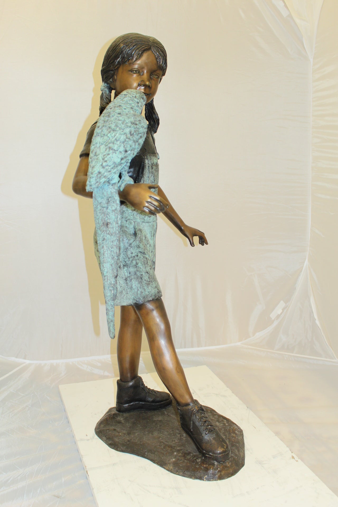 Girl Holding a Parrot Bronze Statue -  Size: 26"L x 19"W x 42"H. 