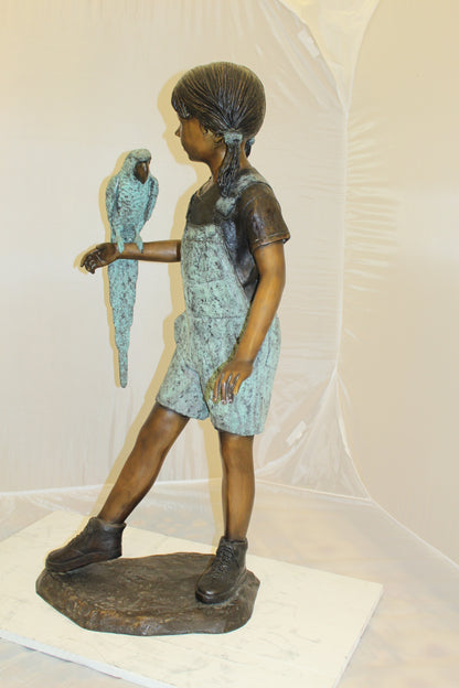 Girl Holding a Parrot Bronze Statue -  Size: 26"L x 19"W x 42"H. 