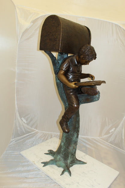 Boy Sitting by a Mailbox reading a book Bronze Statue -  16"L x 20"W x 50"H. 