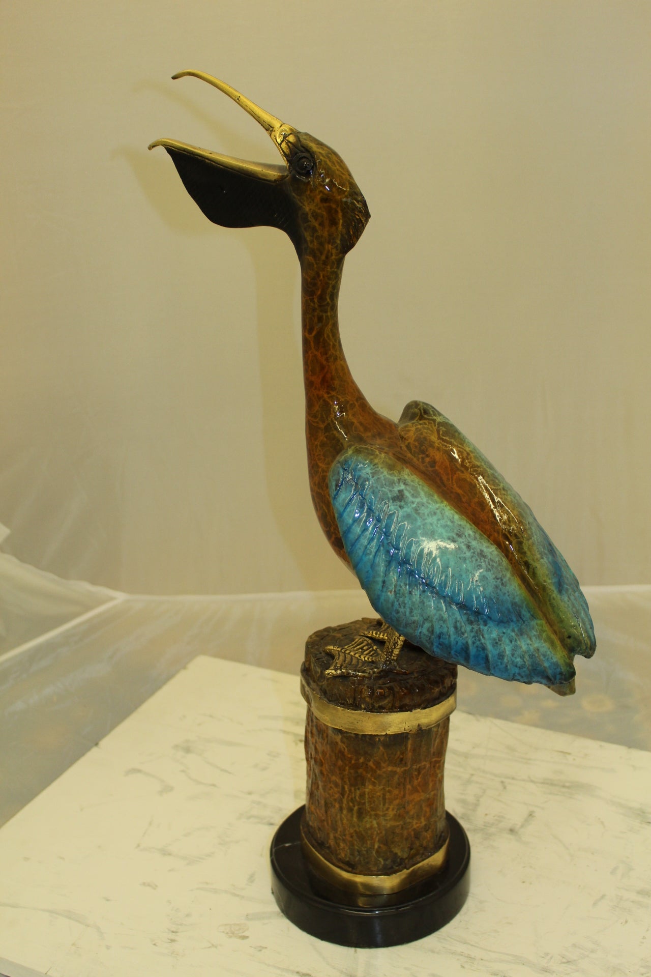 Pelican on a Tree Stump Bronze Statue -  Size: 8"L x 12"W x 27"H. 