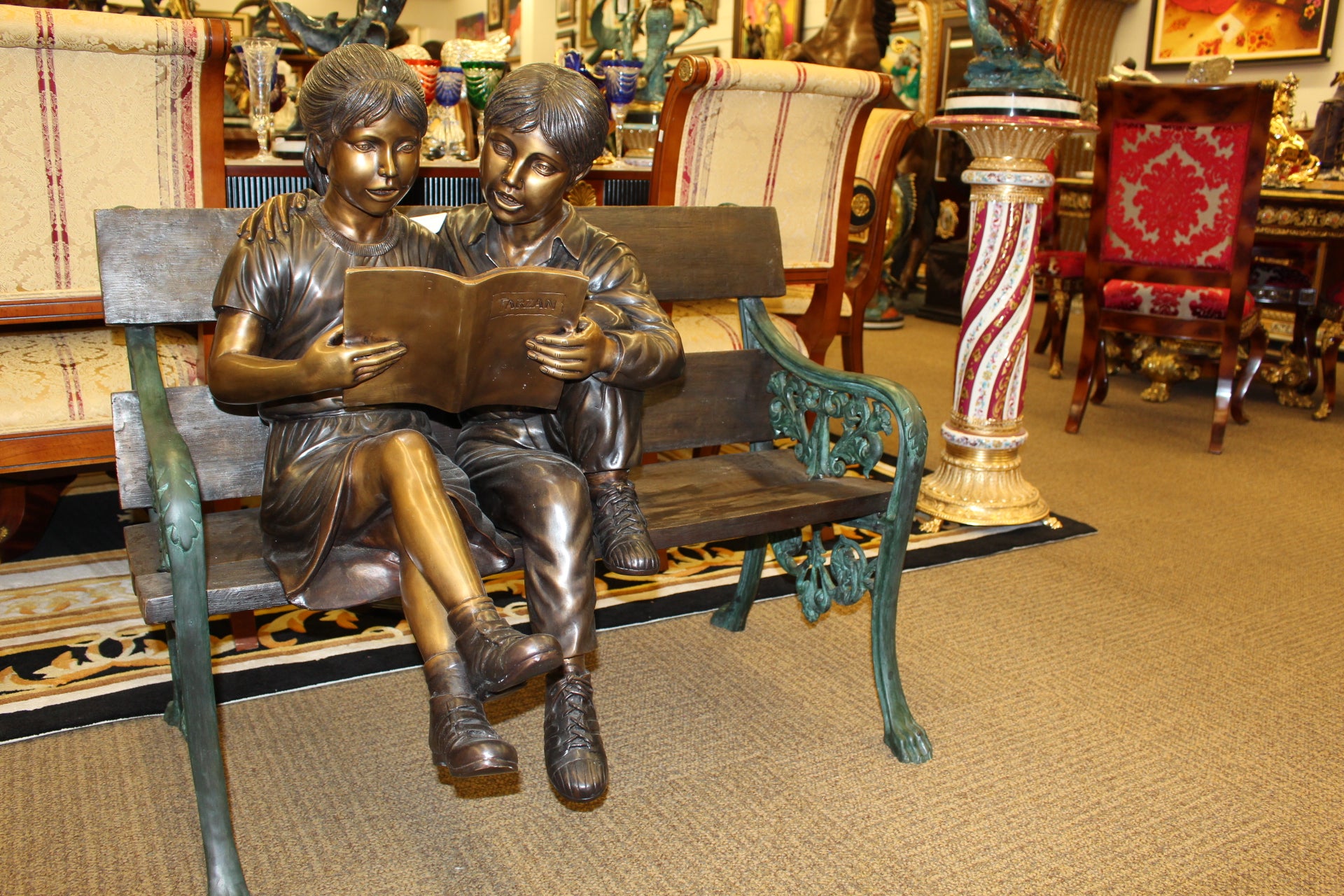 Kids Reading a Book on a Bench Bronze Statue -  Size: 23"L x 38"W x 37"H. 