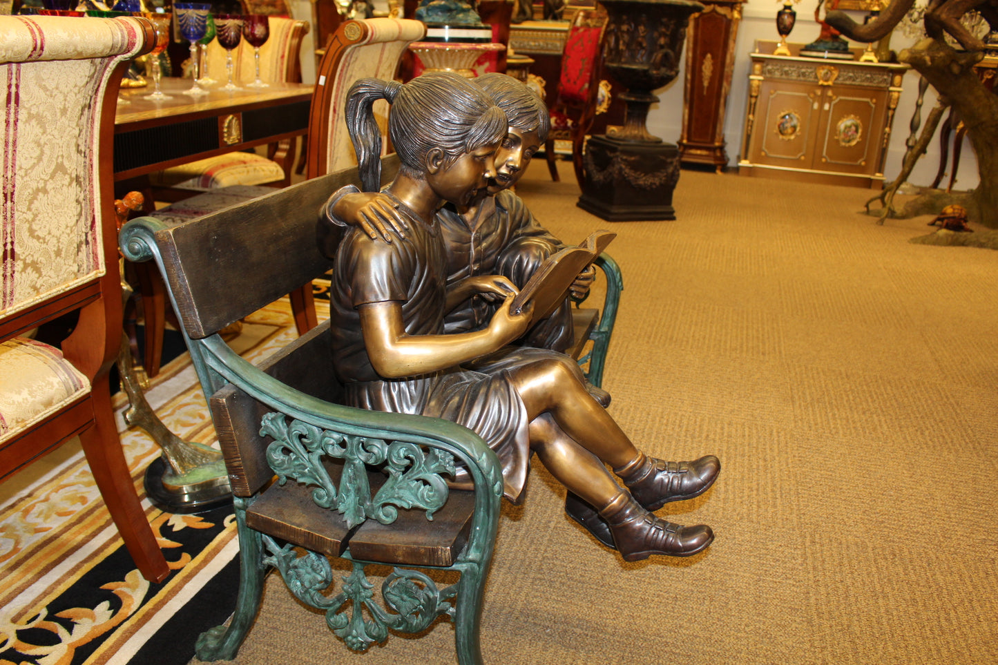 Kids Reading a Book on a Bench Bronze Statue -  Size: 23"L x 38"W x 37"H. 