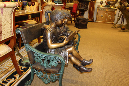 Kids Reading a Book on a Bench Bronze Statue -  Size: 23"L x 38"W x 37"H. 