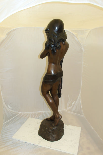 Girl Holding a Sea Shell Bronze Statue -  Size: 13"L x 14"W x 57"H. 