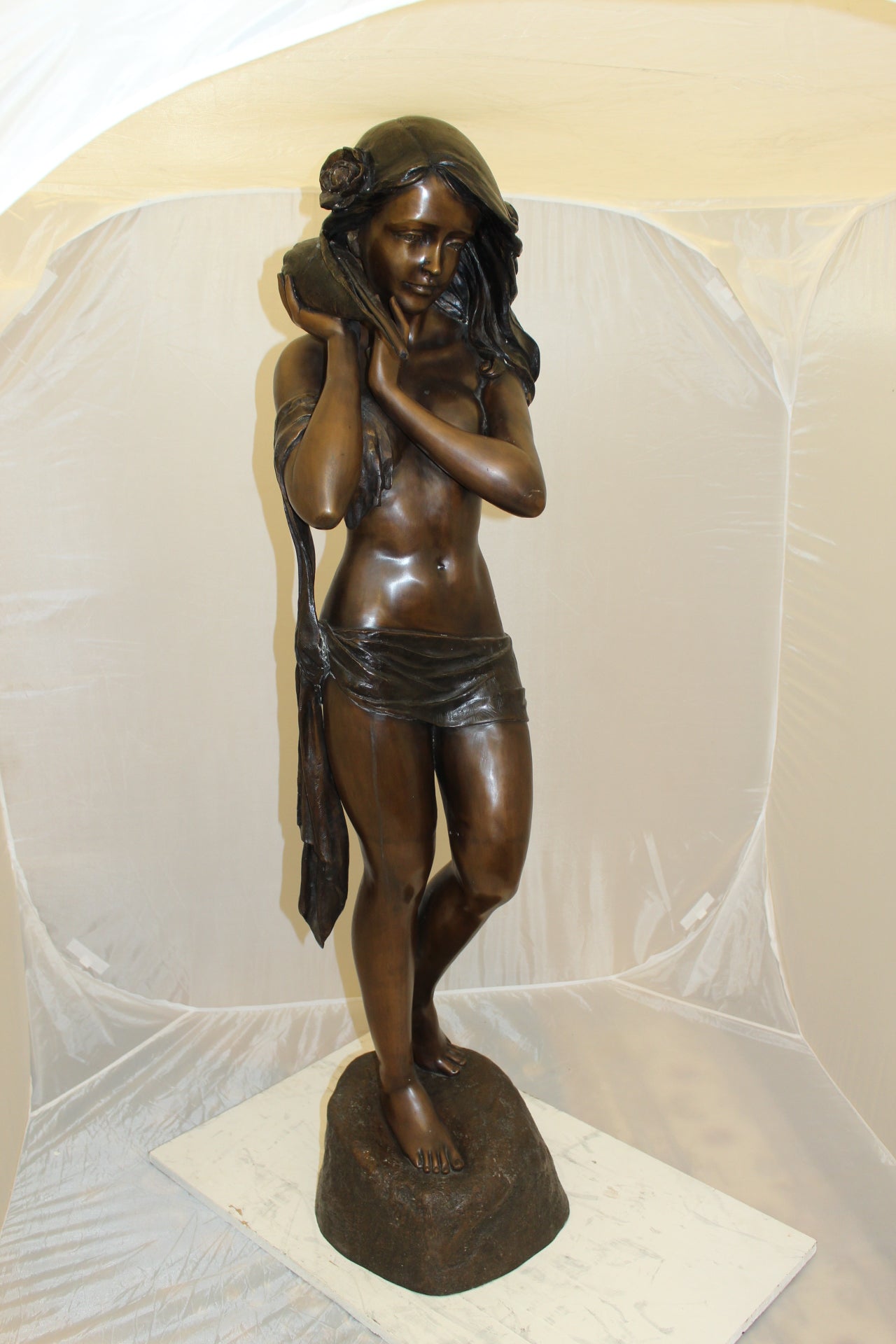 Girl Holding a Sea Shell Bronze Statue -  Size: 13"L x 14"W x 57"H. 