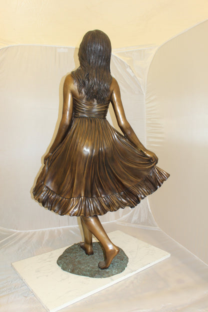Lady holding her Skirt Bronze Statue -  Size: 32"L x 17"W x 53"H. 