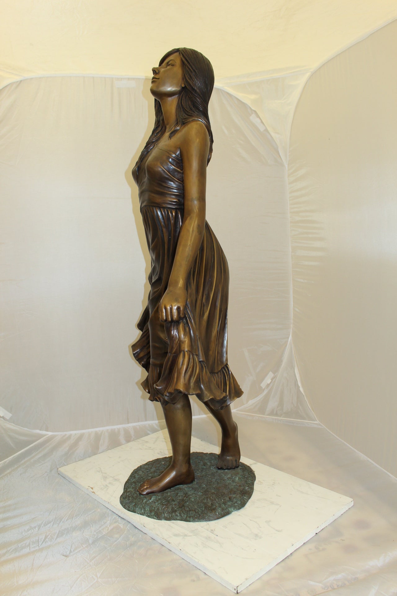 Lady holding her Skirt Bronze Statue -  Size: 32"L x 17"W x 53"H. 