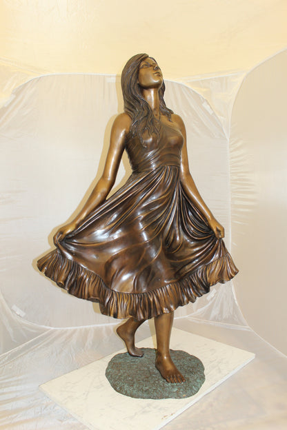 Lady holding her Skirt Bronze Statue -  Size: 32"L x 17"W x 53"H. 
