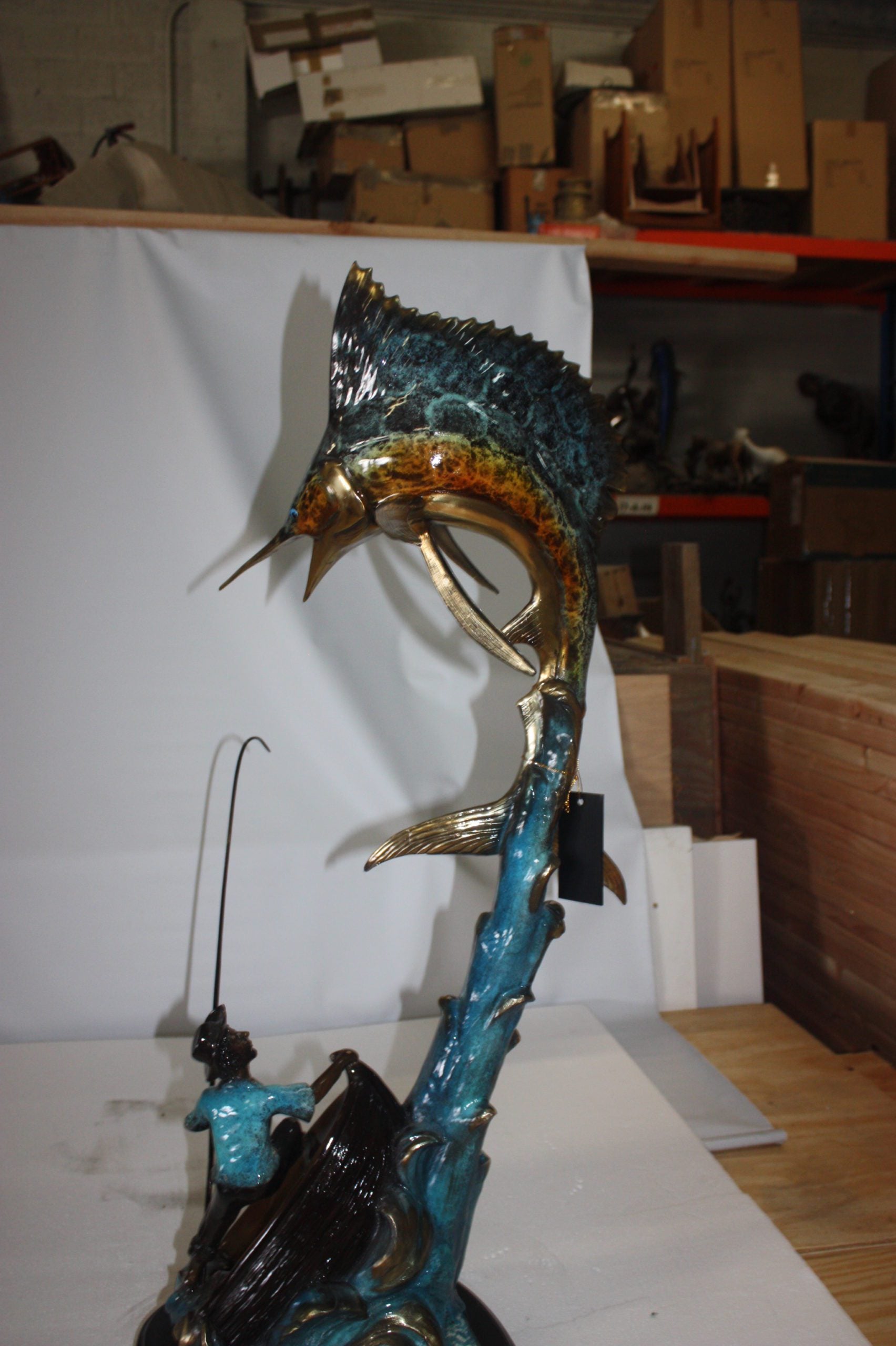 Old man on boat Or fishing man -  Size: 16"L x 12"W x 40"H. 