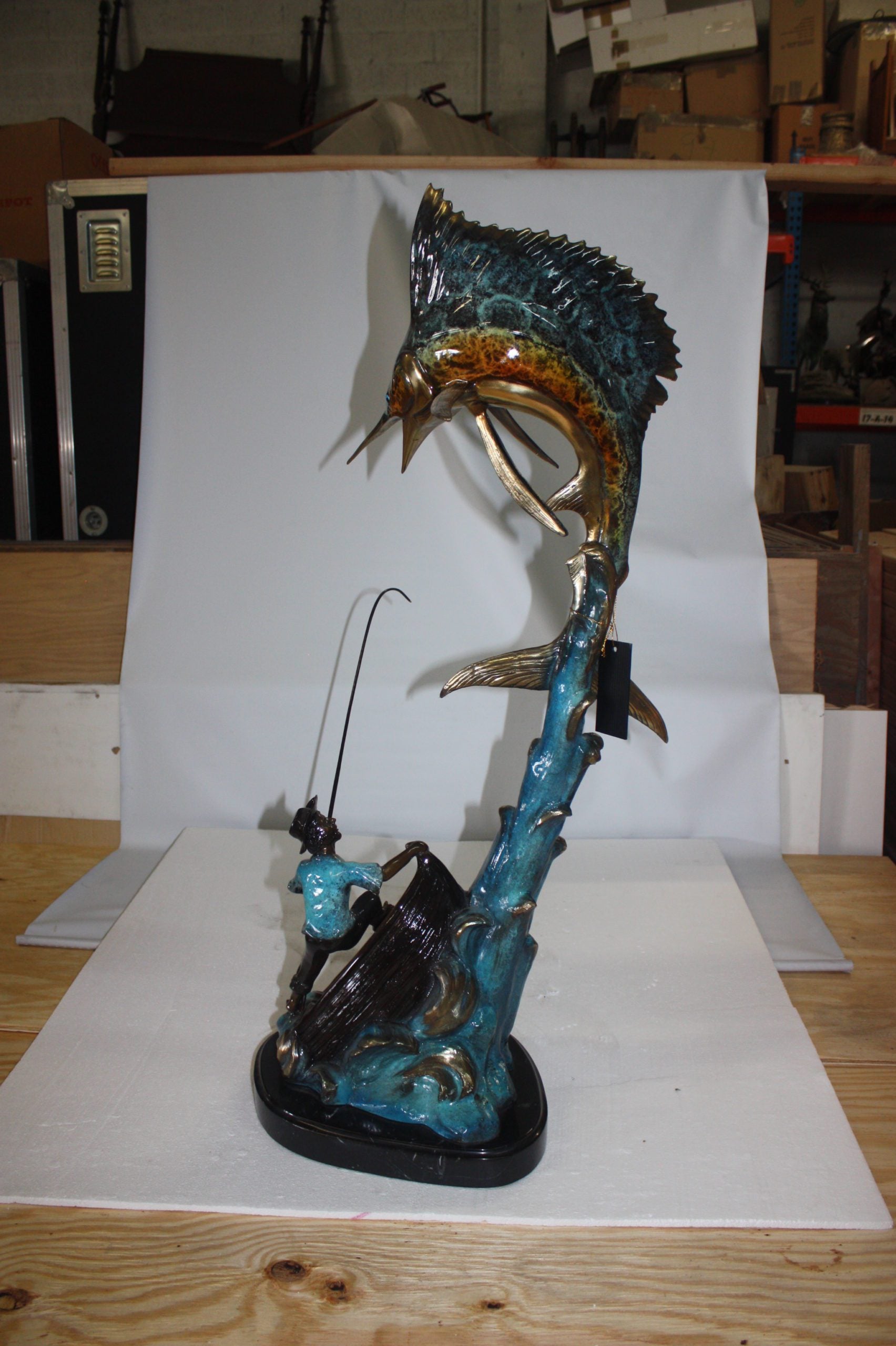 Old man on boat Or fishing man -  Size: 16"L x 12"W x 40"H. 