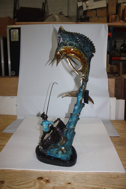 Old man on boat Or fishing man -  Size: 16"L x 12"W x 40"H. 