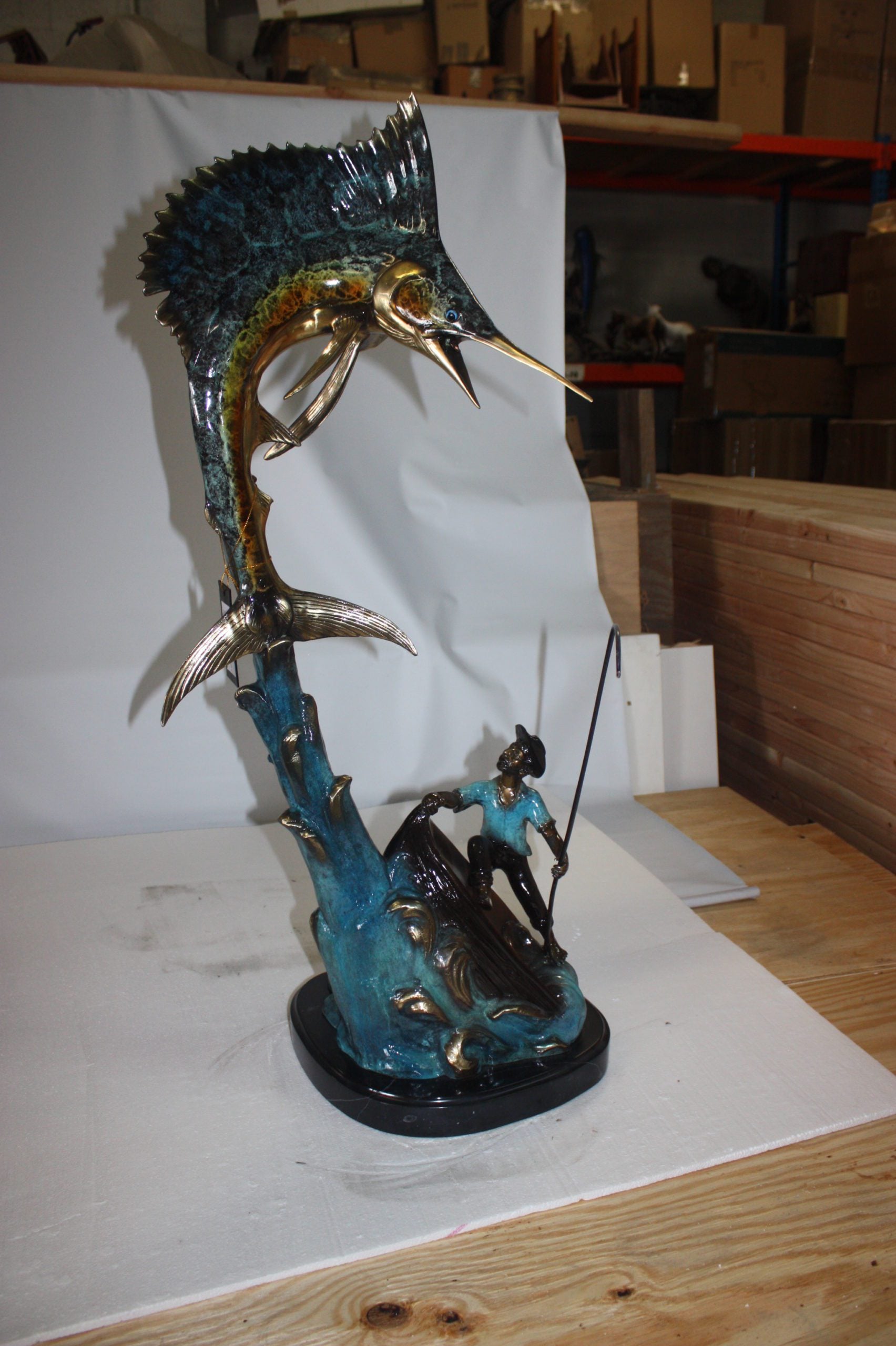 Old man on boat Or fishing man -  Size: 16"L x 12"W x 40"H. 
