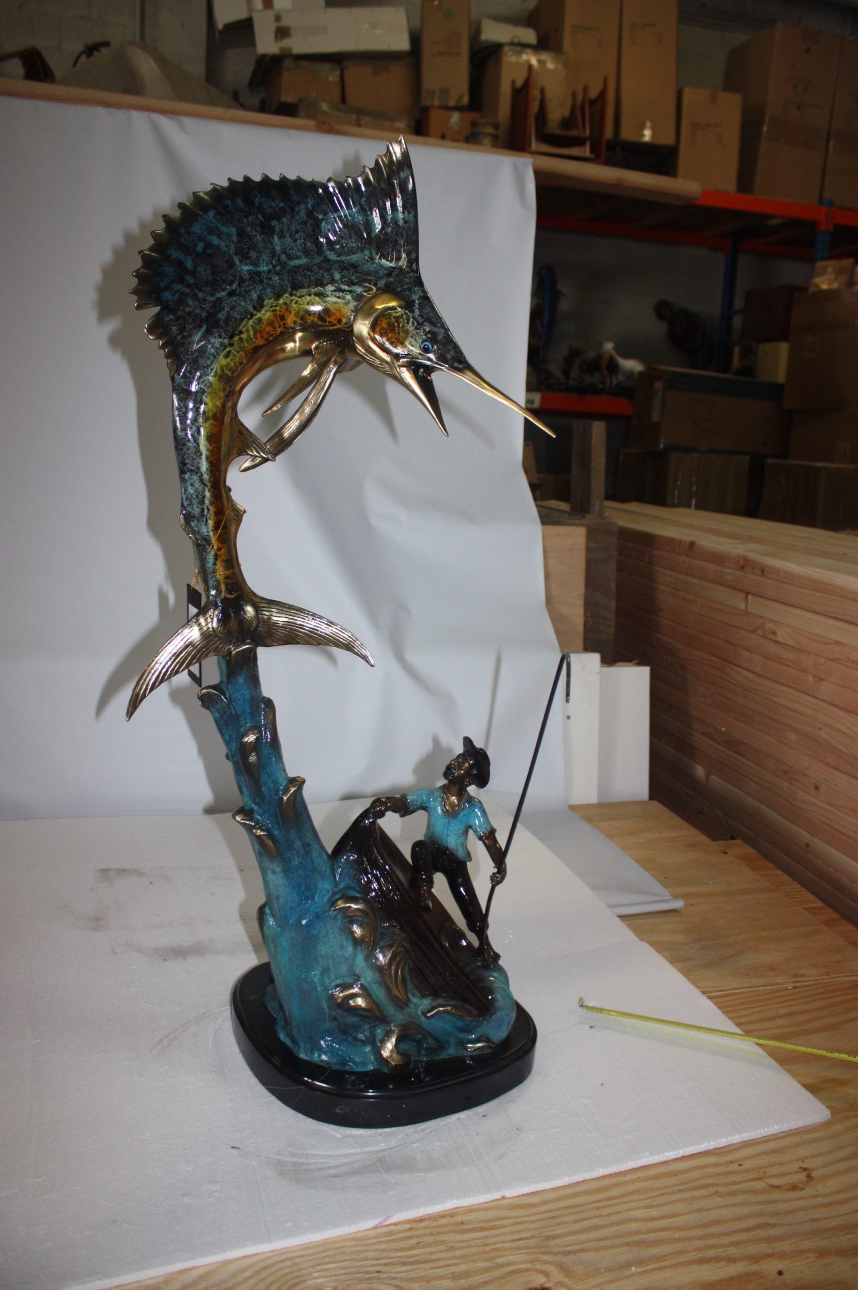 Old man on boat Or fishing man -  Size: 16"L x 12"W x 40"H. 