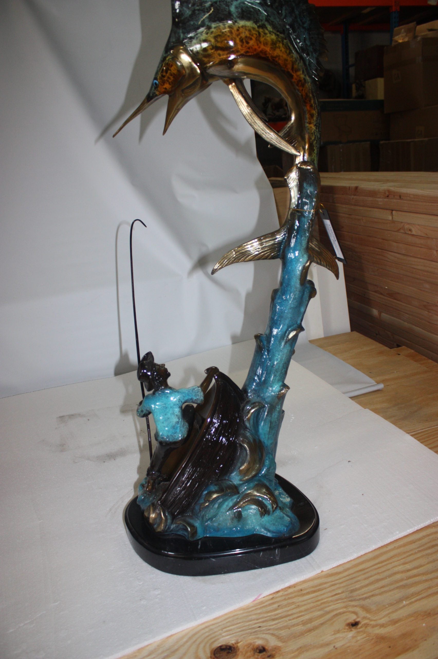 Old man on boat Or fishing man -  Size: 16"L x 12"W x 40"H. 