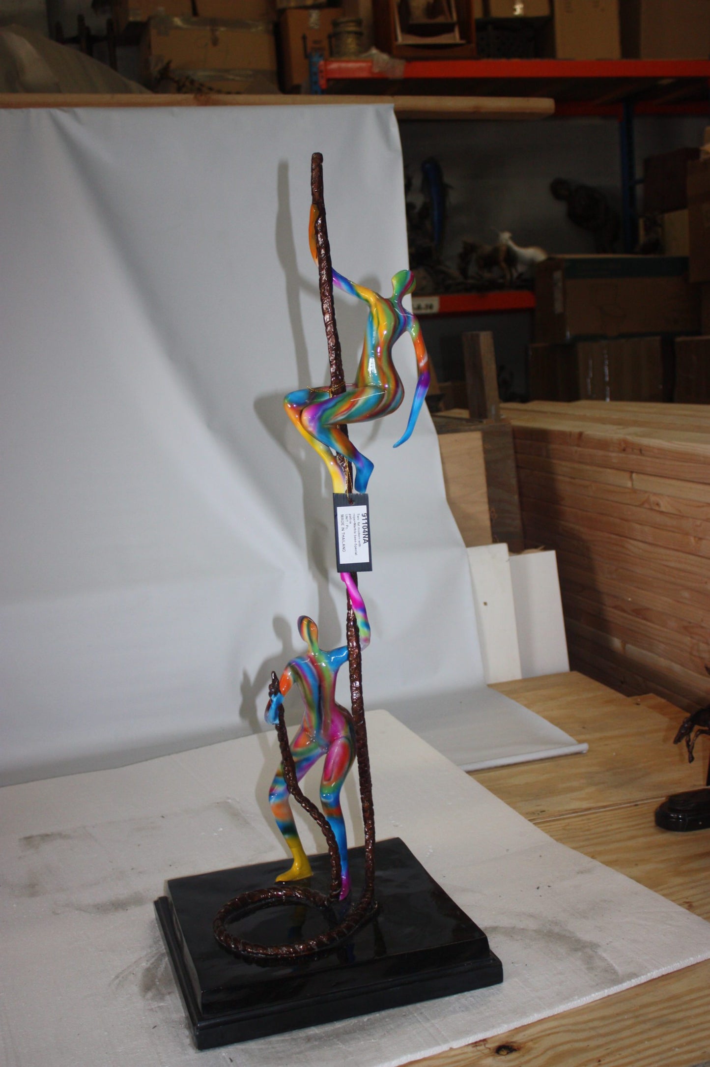 Two boys made of Bronze climbing on rope -  Size: 14"L x 14"W x 39"H. 