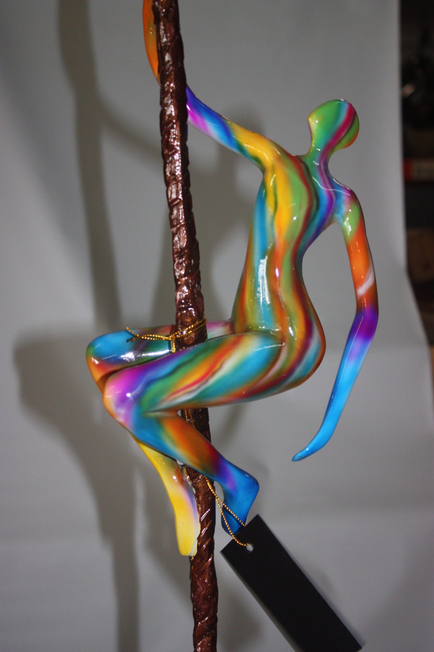 Two boys made of Bronze climbing on rope -  Size: 14"L x 14"W x 39"H. 