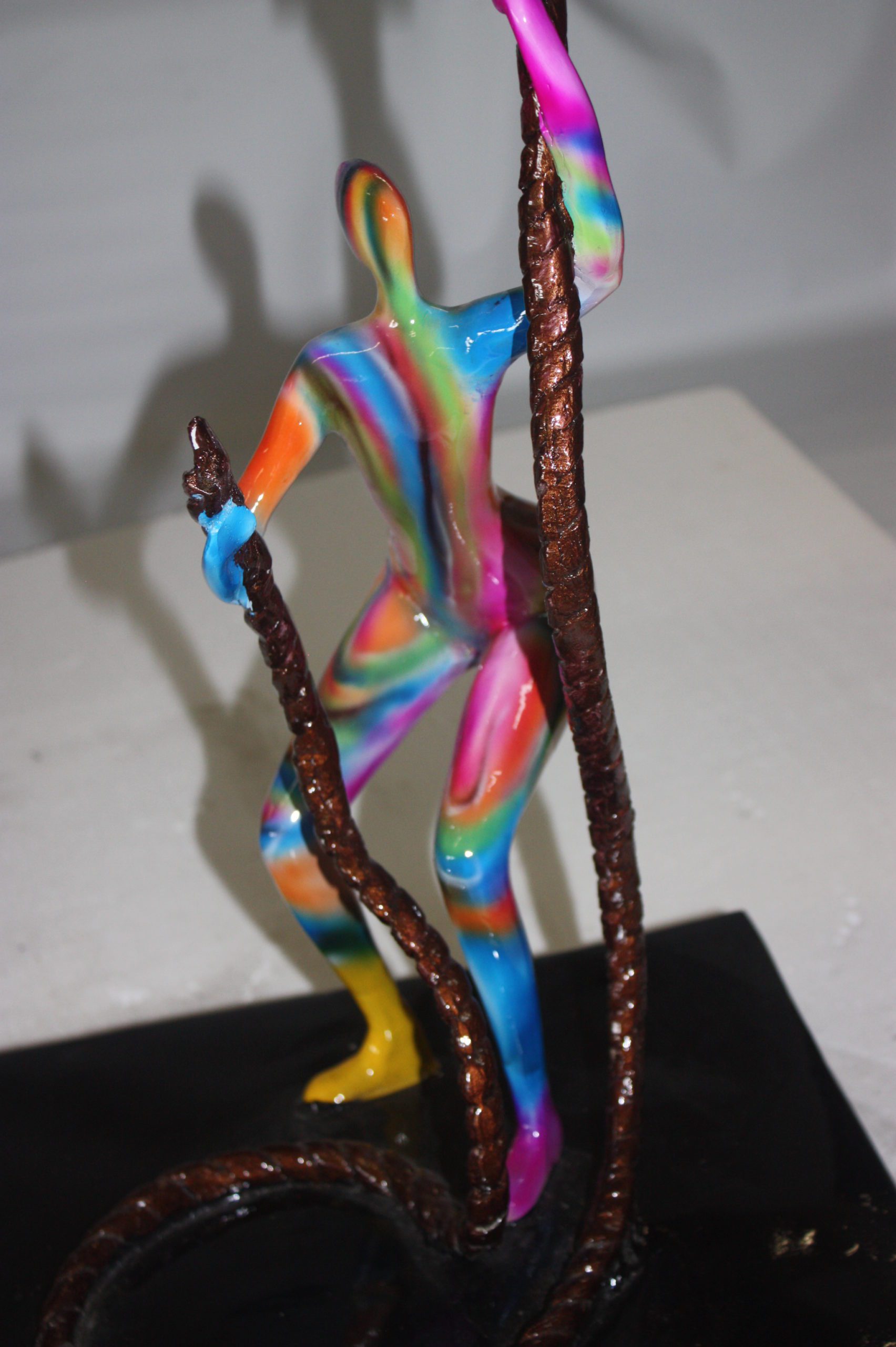 Two boys made of Bronze climbing on rope -  Size: 14"L x 14"W x 39"H. 