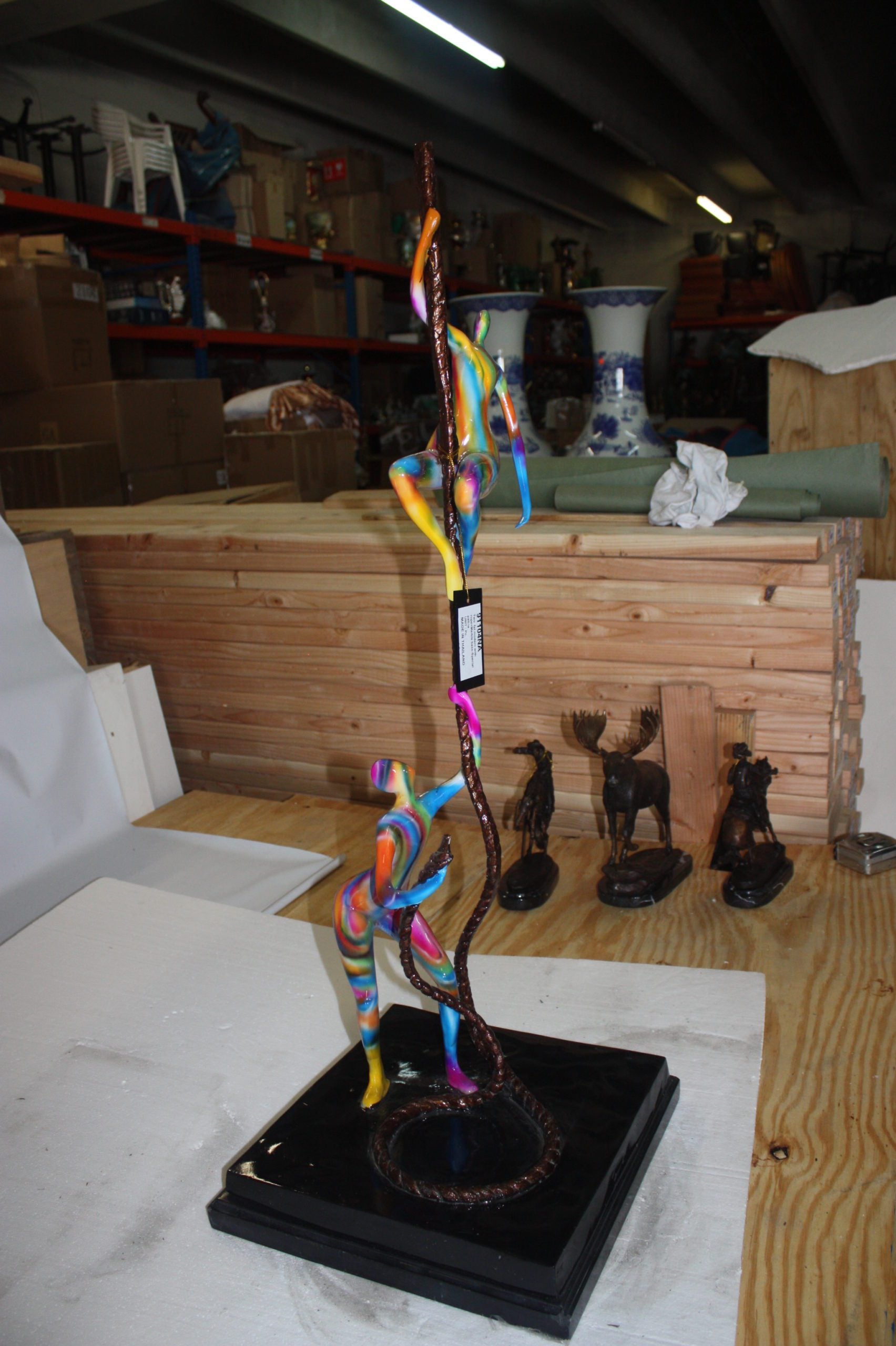 Two boys made of Bronze climbing on rope -  Size: 14"L x 14"W x 39"H. 