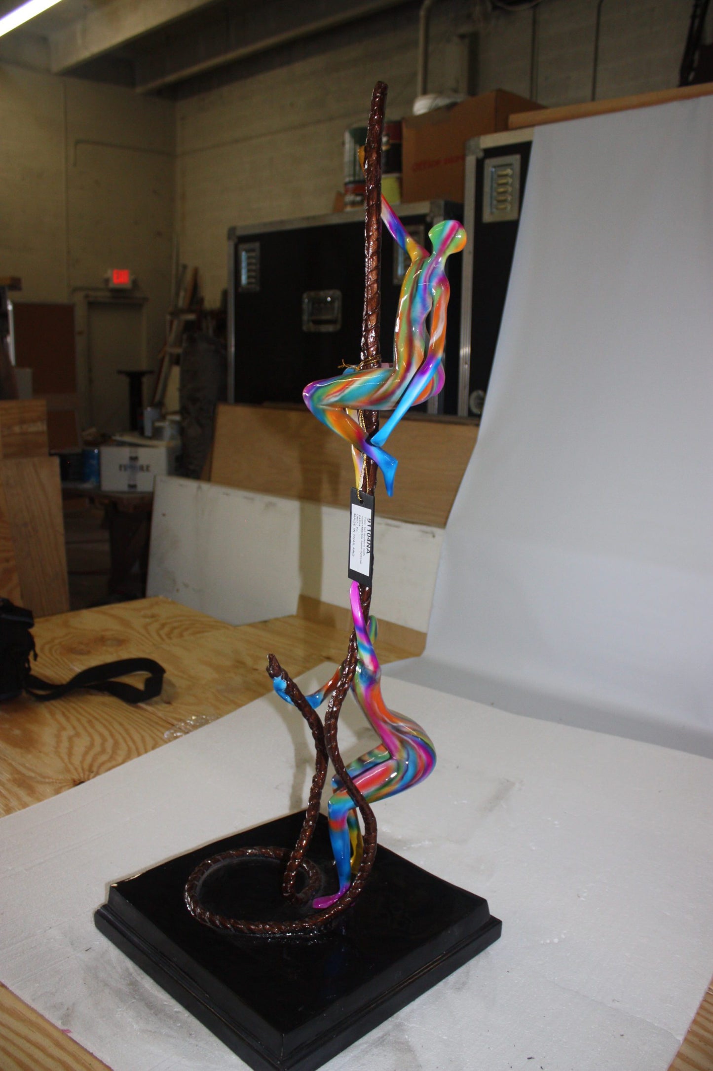 Two boys made of Bronze climbing on rope -  Size: 14"L x 14"W x 39"H. 