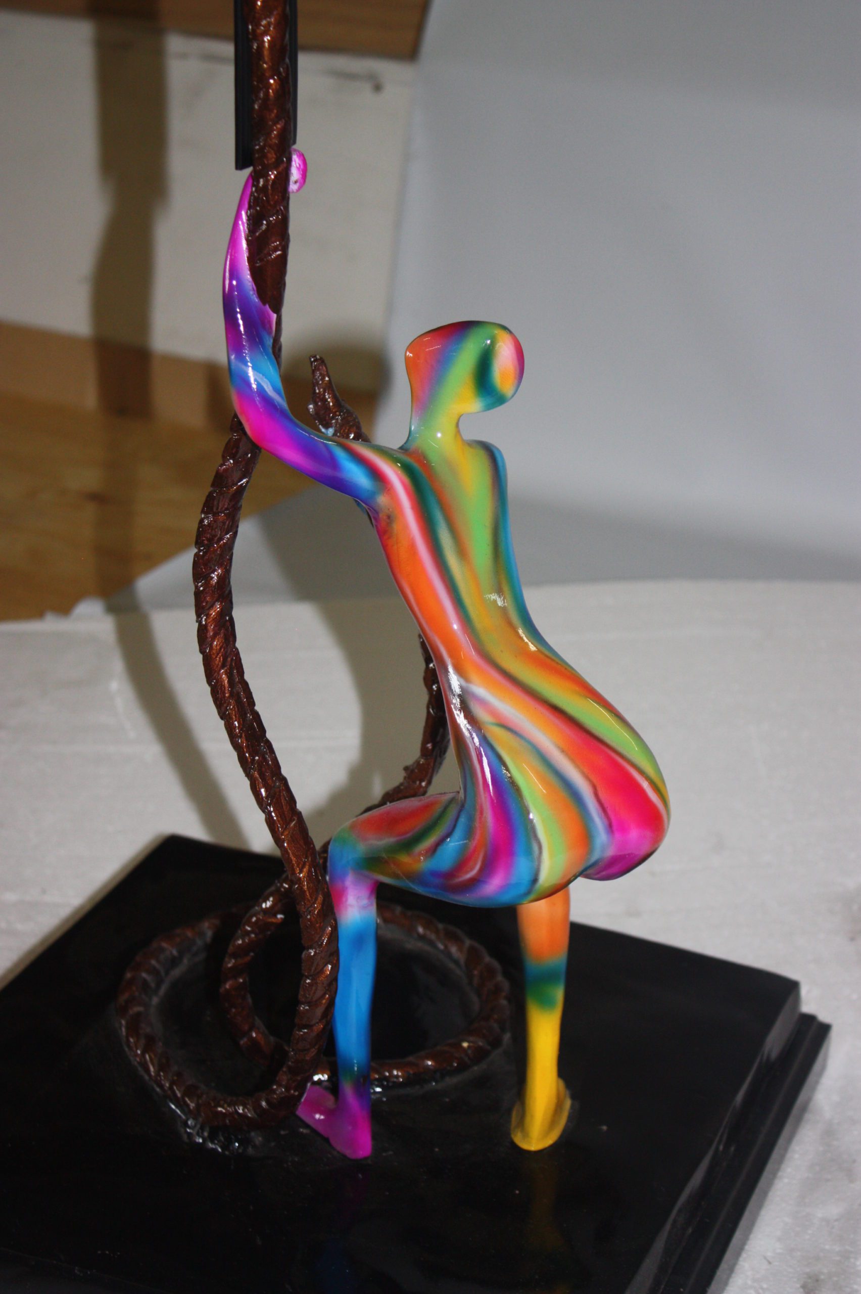Two boys made of Bronze climbing on rope -  Size: 14"L x 14"W x 39"H. 