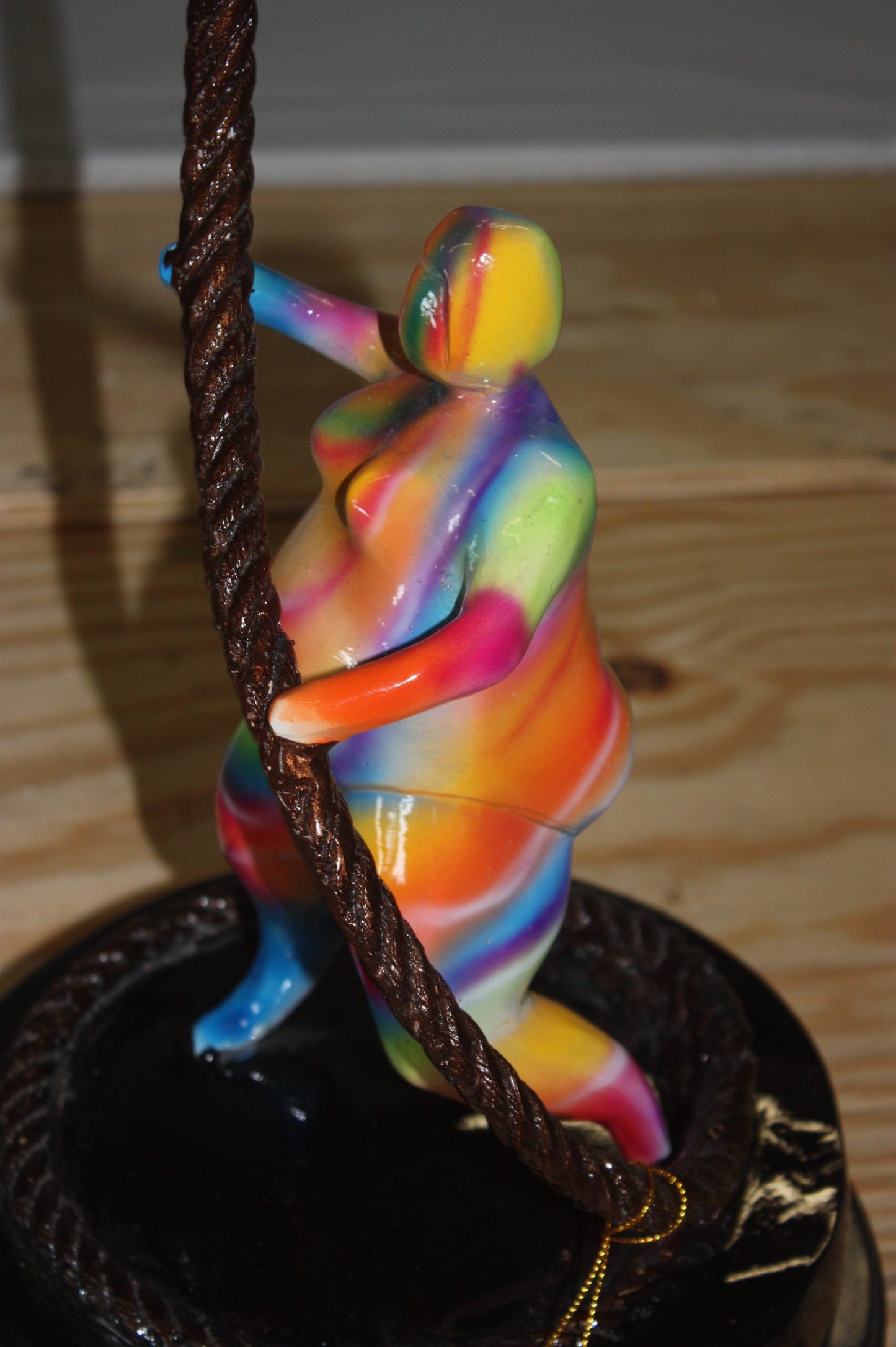 Two fat ladies made of Bronze climbing on rope -  Size: 10"L x 10"W x 31"H. 