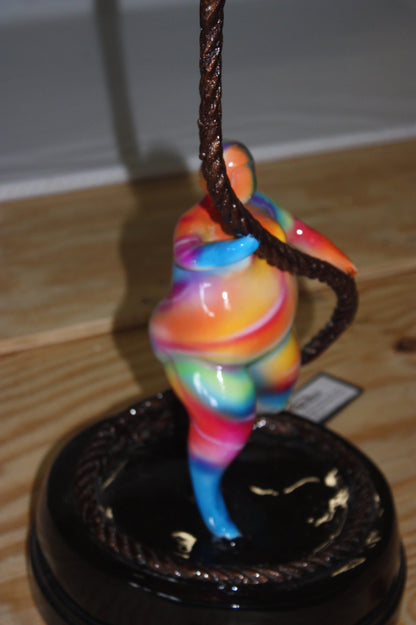 Two fat ladies made of Bronze climbing on rope -  Size: 10"L x 10"W x 31"H. 