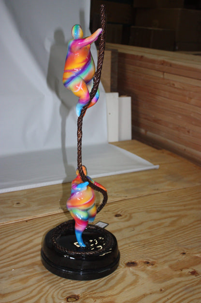 Two fat ladies made of Bronze climbing on rope -  Size: 10"L x 10"W x 31"H. 