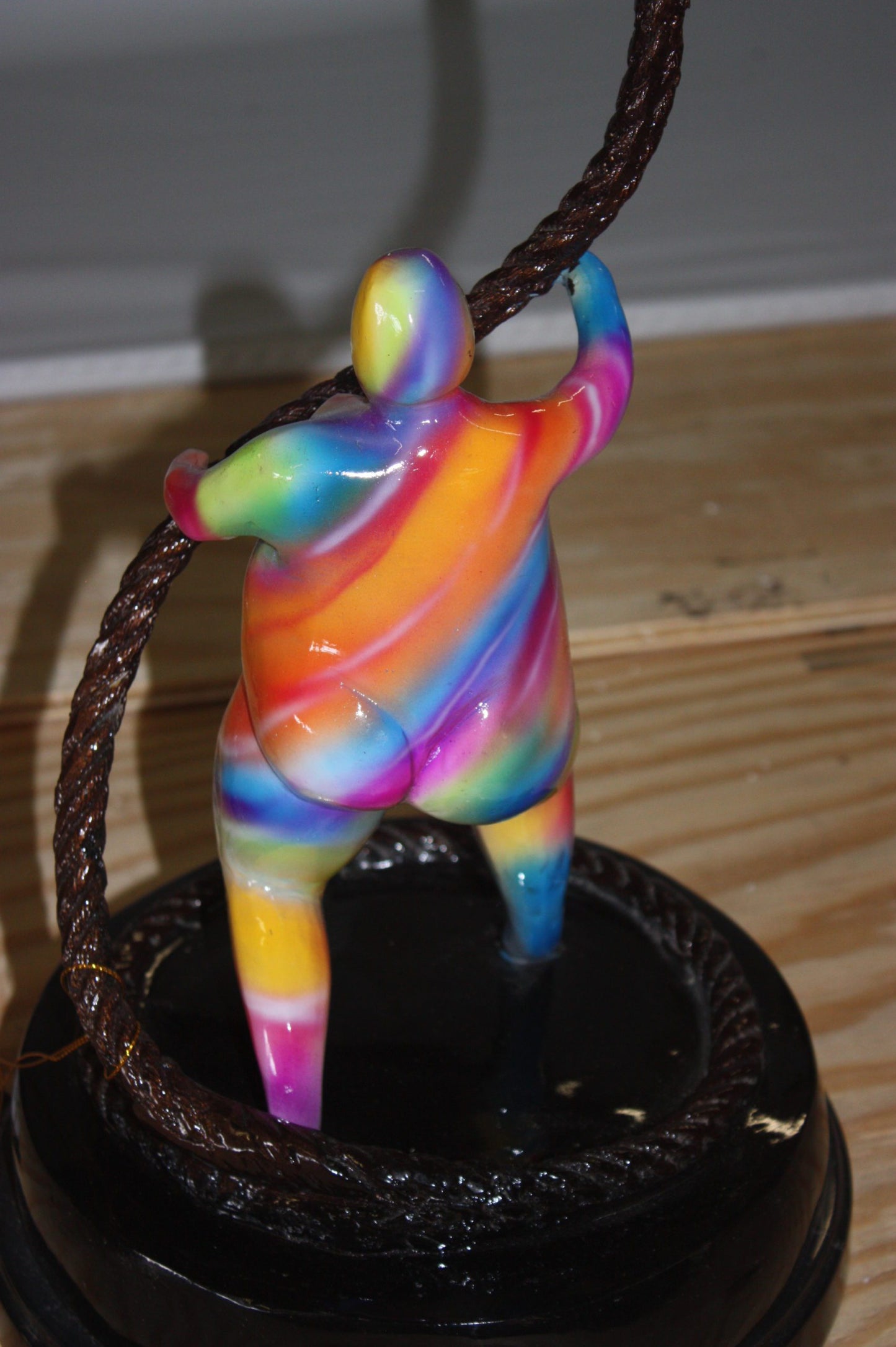 Two fat ladies made of Bronze climbing on rope -  Size: 10"L x 10"W x 31"H. 