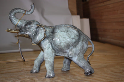 Elephant with trunk up -  Statue -  Size: 13.5"L x 5"W x 12"H. 
