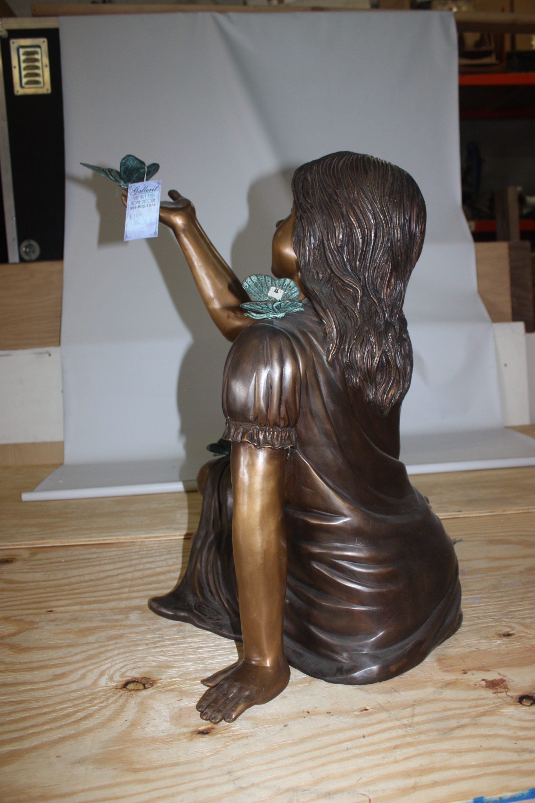 Girl with butterflies  - Bronze Statue -  Size: 27"L x 17"W x 24"H. 
