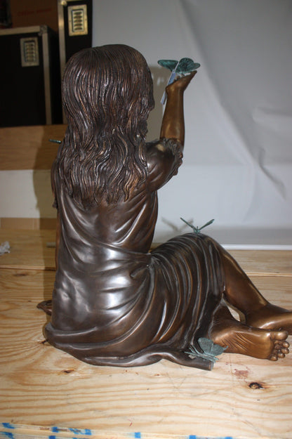 Girl with butterflies  - Bronze Statue -  Size: 27"L x 17"W x 24"H. 