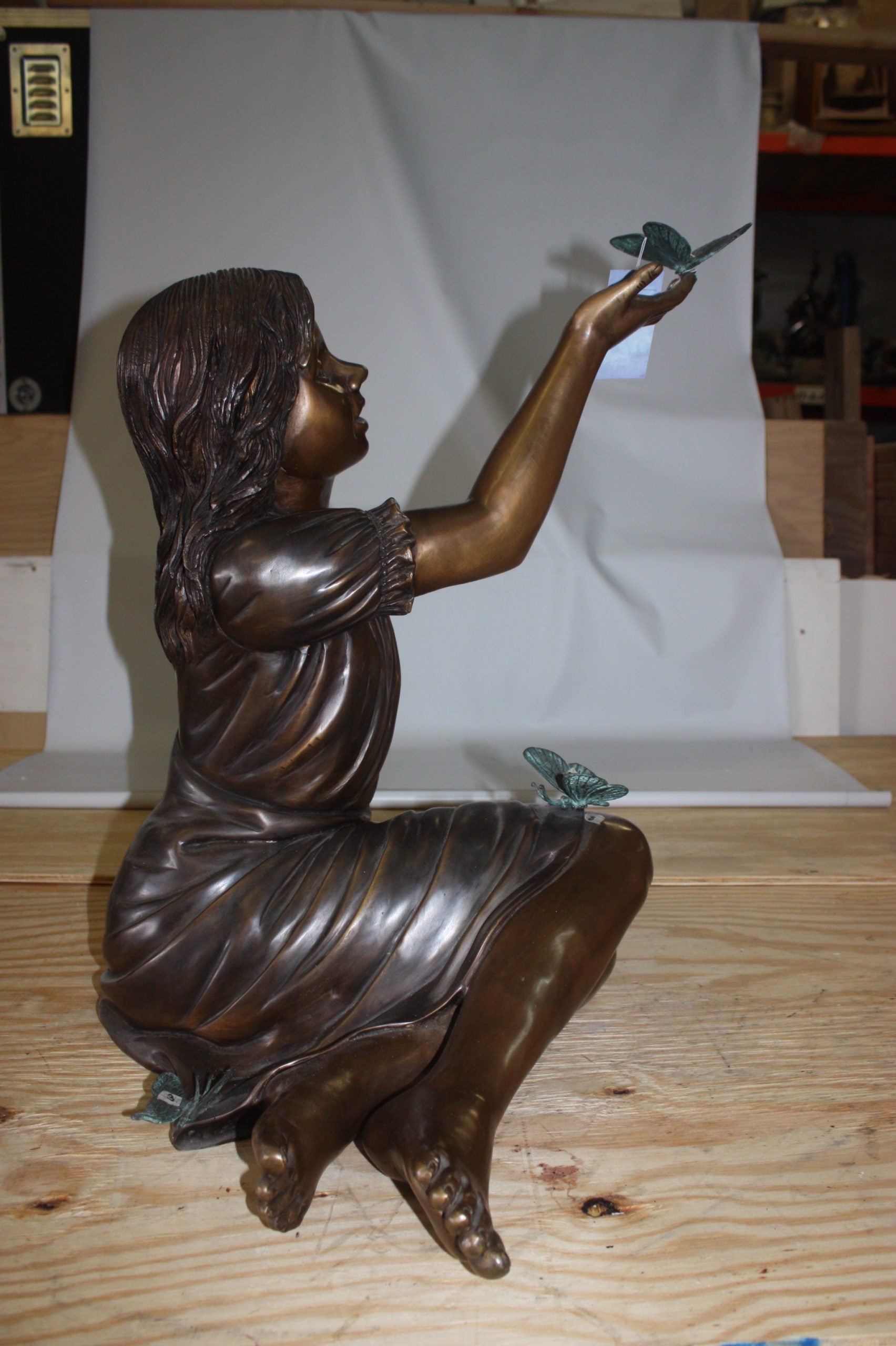 Girl with butterflies  - Bronze Statue -  Size: 27"L x 17"W x 24"H. 