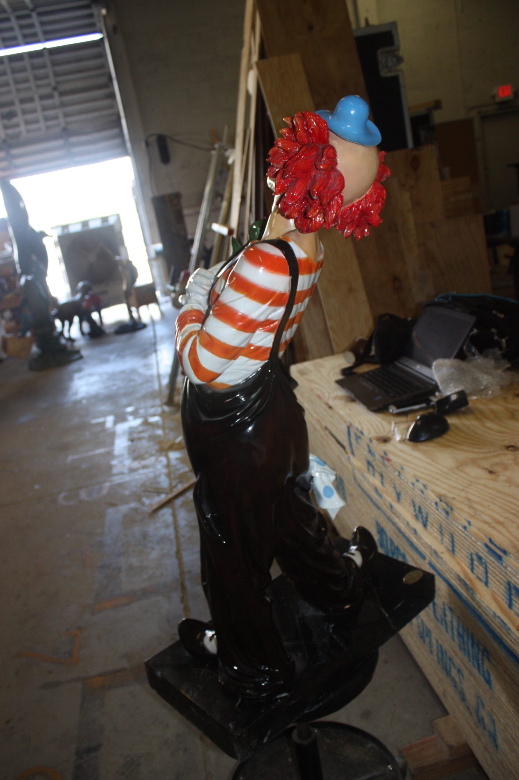 Standing clown with flowers - Bronze Statue -  Size: 21"L x 10.5"W x 38"H. 