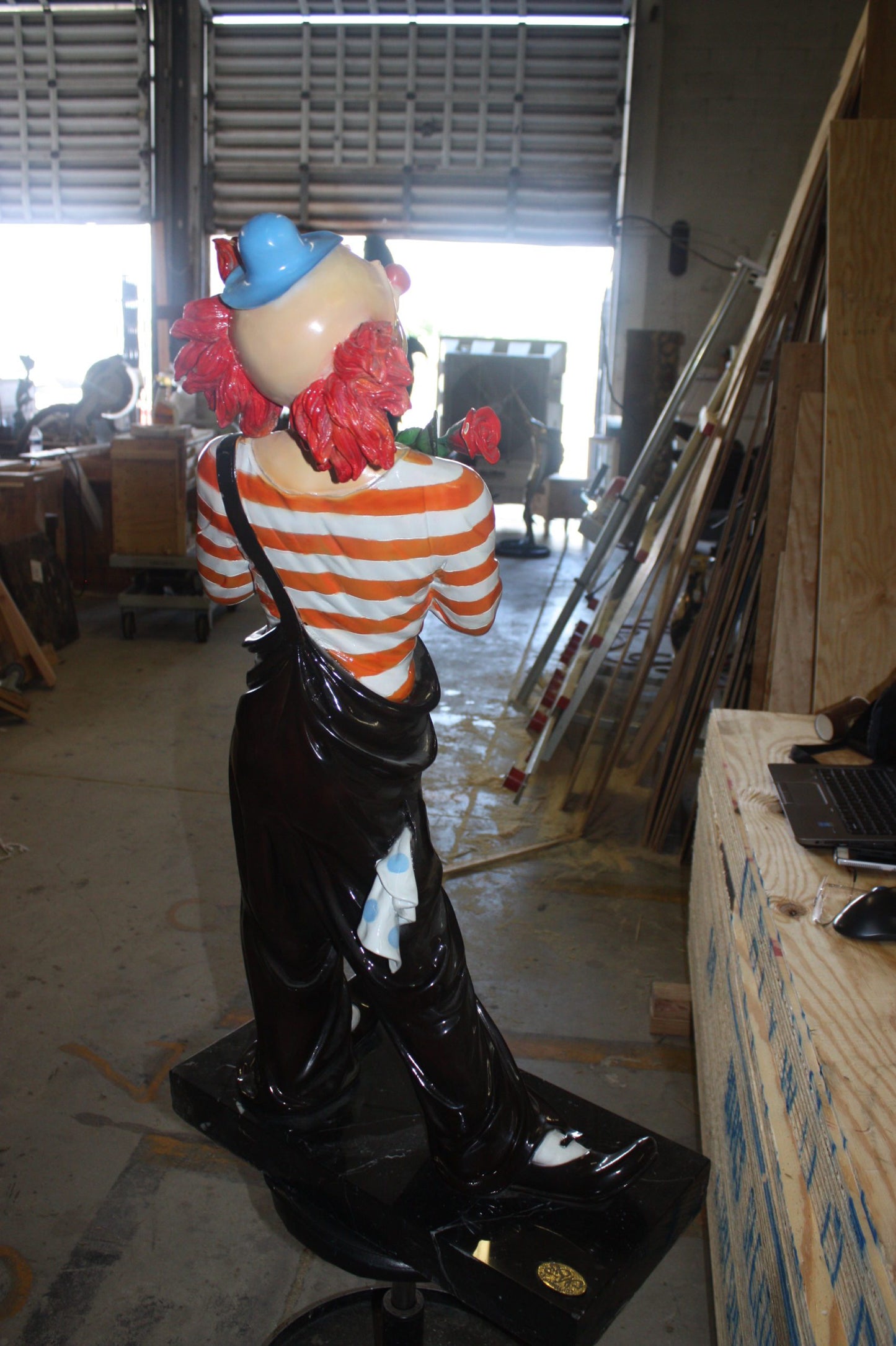 Standing clown with flowers - Bronze Statue -  Size: 21"L x 10.5"W x 38"H. 