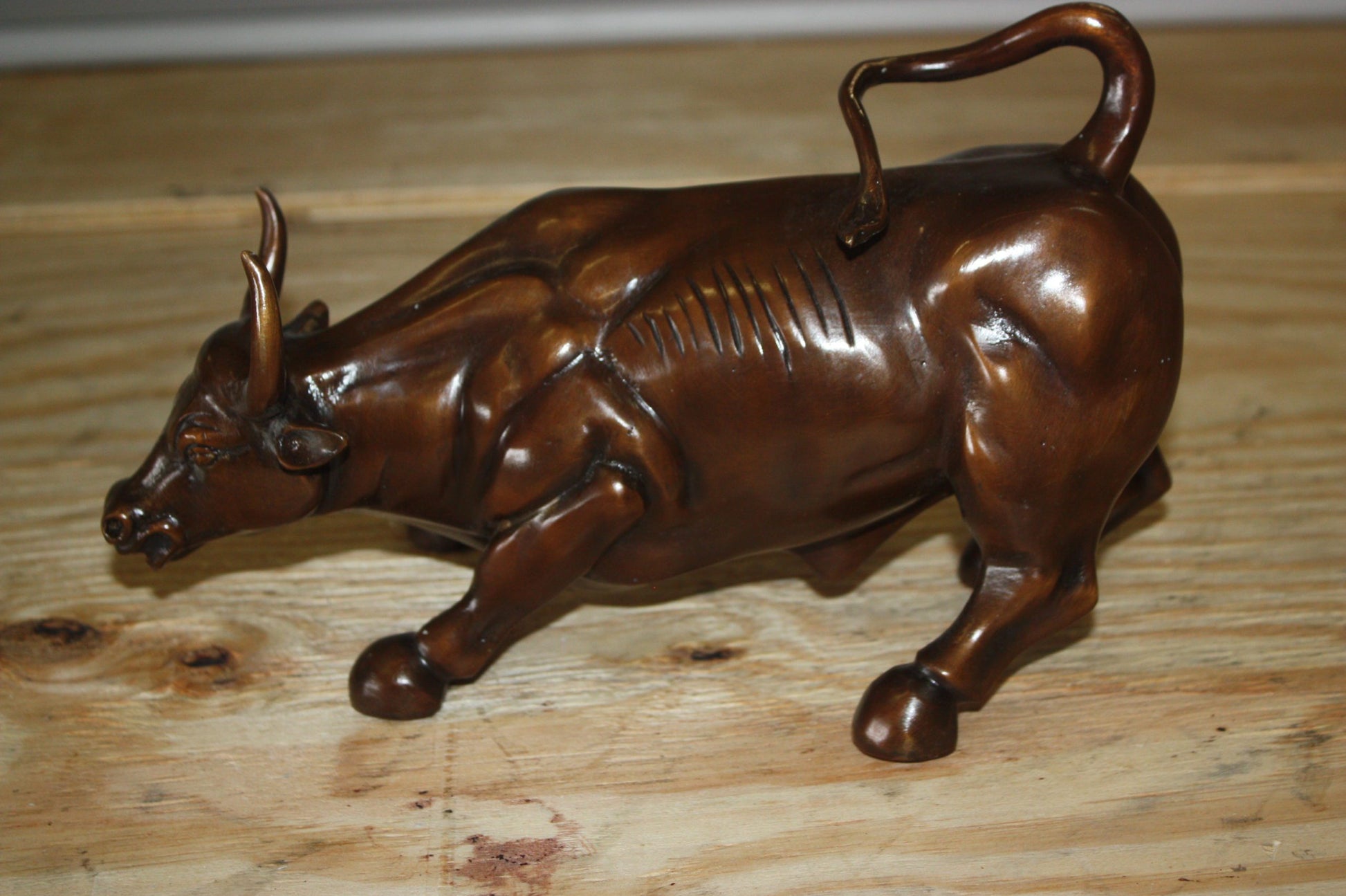 Wall street bull small - Bronze Statue -  Size: 12"L x 6"W x 7.5"H. 