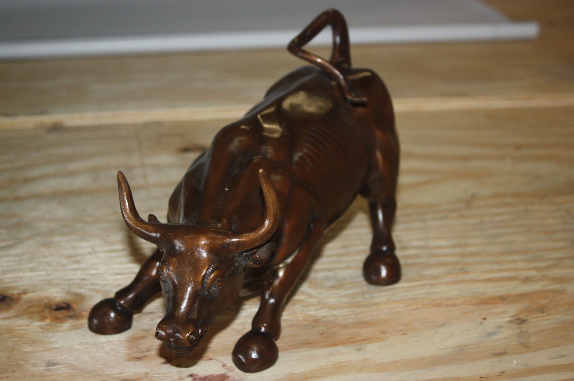 Wall street bull small - Bronze Statue -  Size: 12"L x 6"W x 7.5"H. 