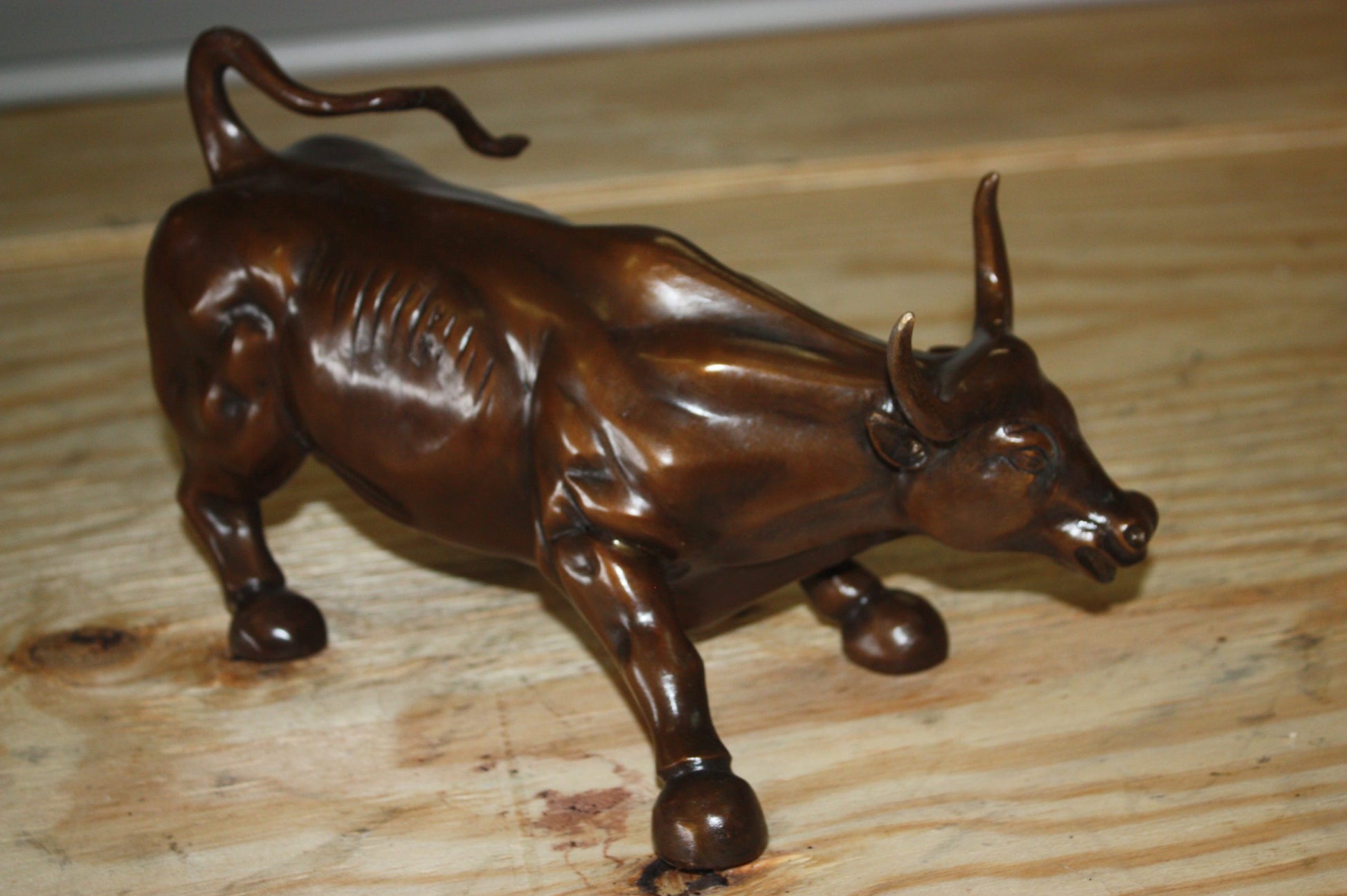 Wall street bull small - Bronze Statue -  Size: 12"L x 6"W x 7.5"H. 