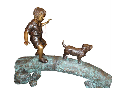 Kid with dog walking on a log Bronze Statue -  Size: 57"L x 18"W x 41"H. 