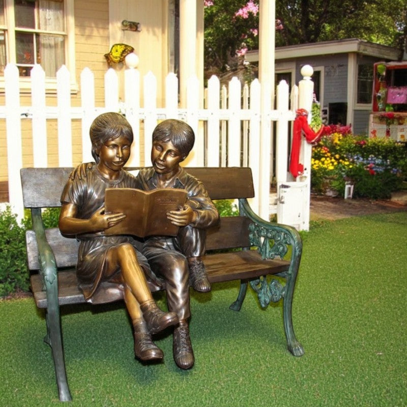 Kids Reading a Book on a Bench Bronze Statue -  Size: 23"L x 38"W x 37"H.