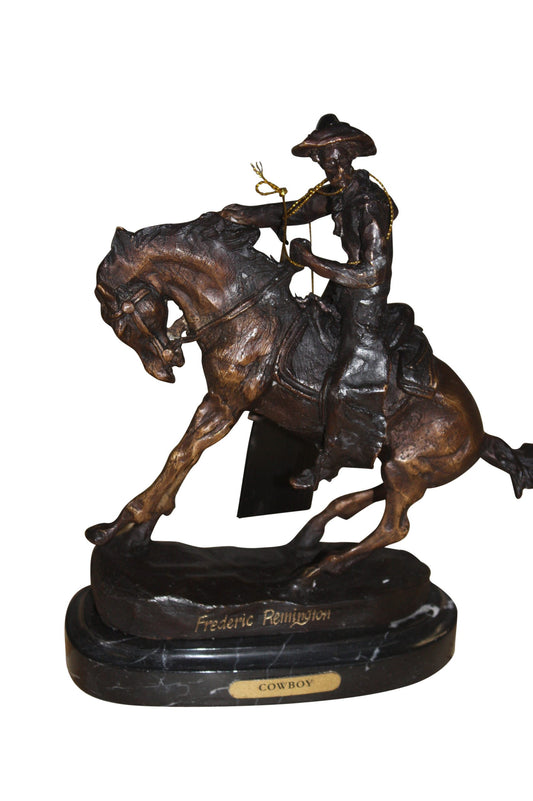 Remington Cowboy on marble Bronze Statue -  Size: 10"L x 3.5"W x 10"H. 