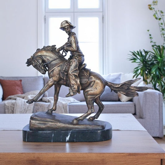Remington replica Cowboy bronze statue -  Size: 5"L x 15"W x 13"H.