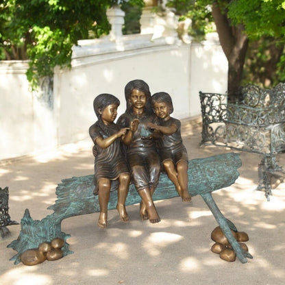 Three Children On Log Holding Bird Bronze Statue -  Size: 55"L x 18"W x 38"H.
