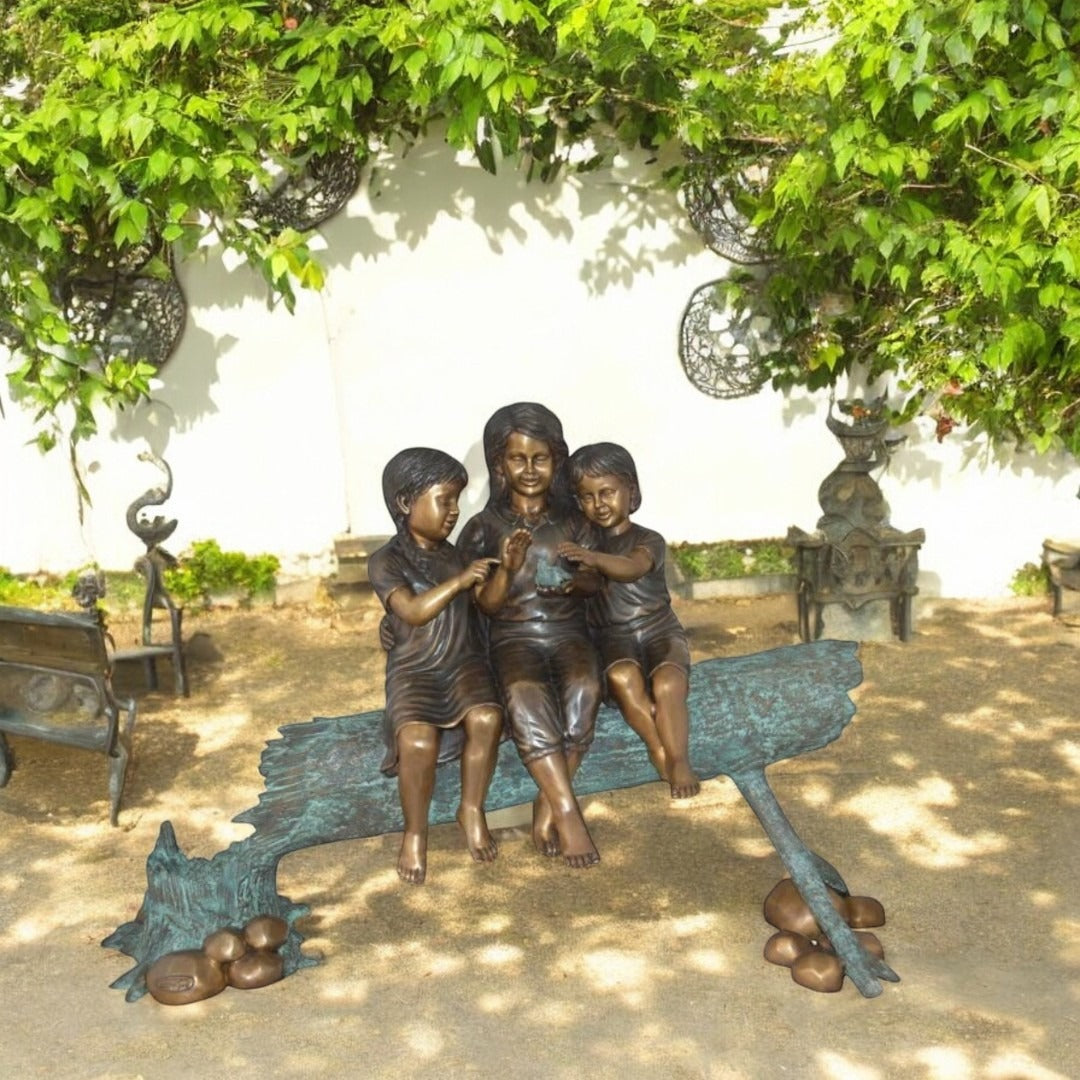 Three Children On Log Holding Bird Bronze Statue -  Size: 55"L x 18"W x 38"H.