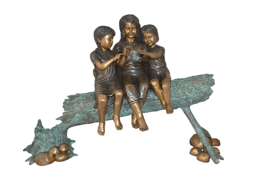 Three Children On Log Holding Bird Bronze Statue -  Size: 55"L x 18"W x 38"H.