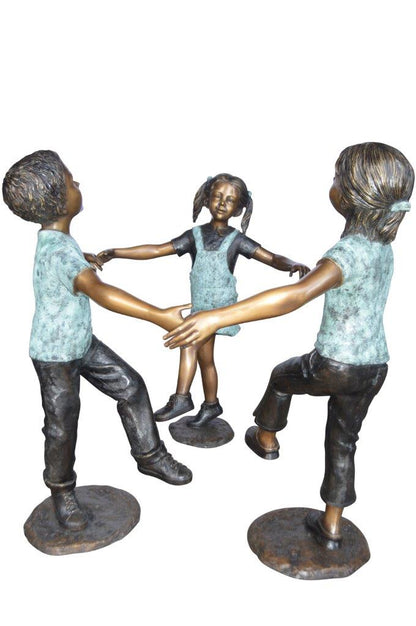 Three children happily holding hands bronze statue -  Size: 31"L x 19"W x 41"H.