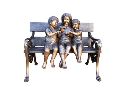 Three kids on a Bench Holding a Bird Bronze Statue -  Size: 40"L x 30"W x 33"H.